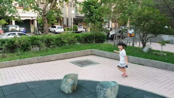 kid playing in garden